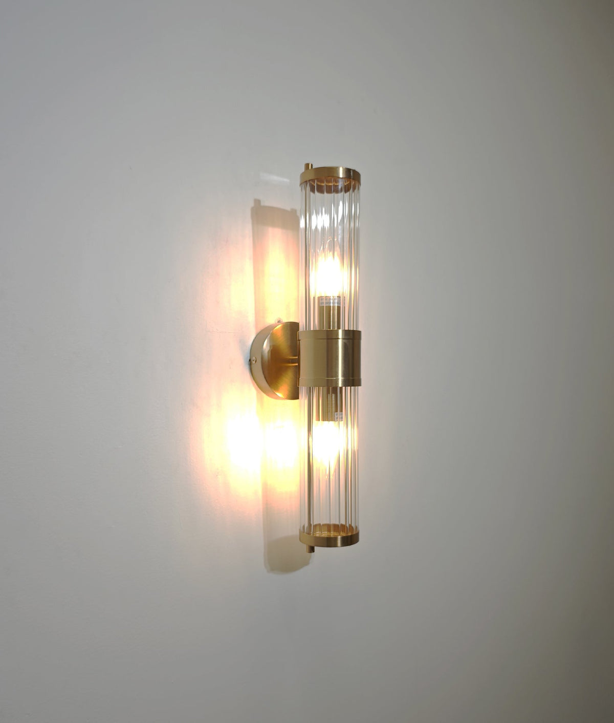 Tiempo Interior Up/Down Tubular Clear Glass Wall Light - Antique Brass