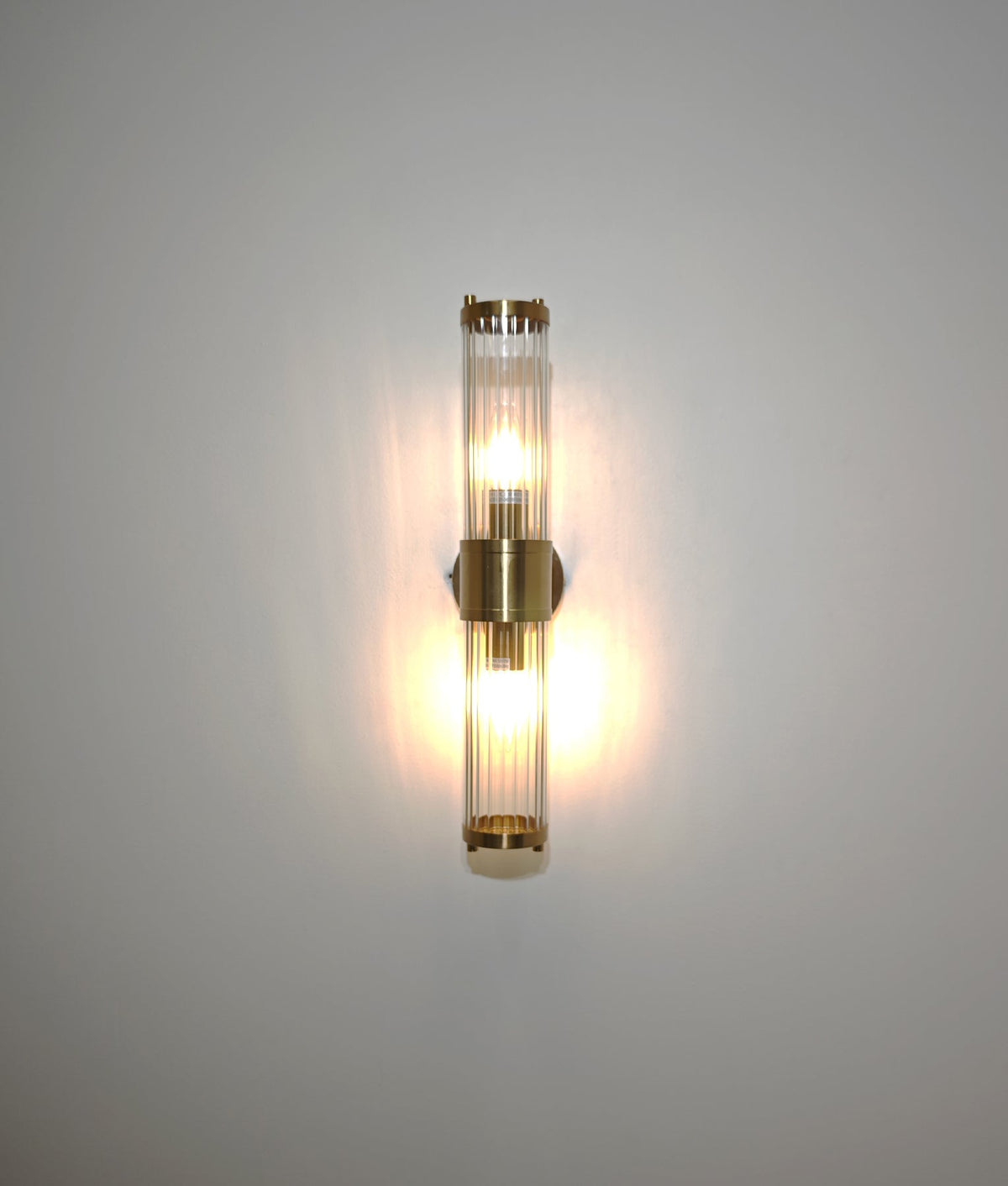 Tiempo Interior Up/Down Tubular Clear Glass Wall Light - Antique Brass